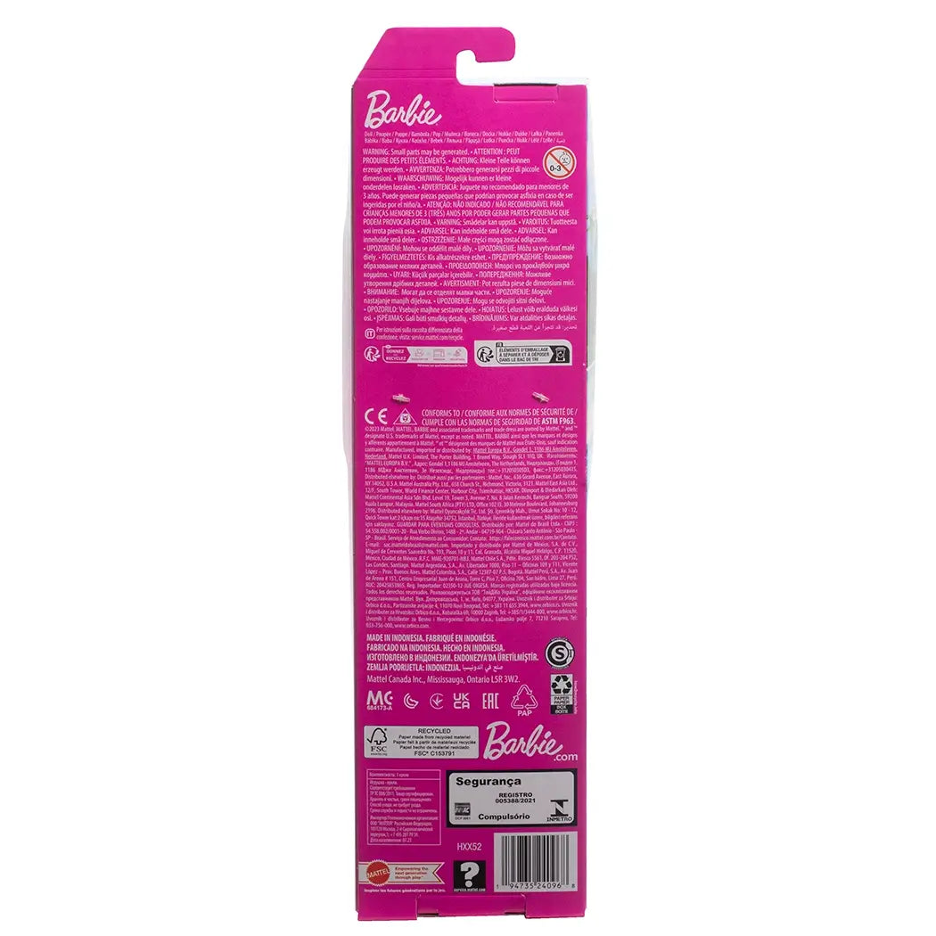 Back of Beach Ken doll packaging with product details, safety warnings, and Barbie branding on bright pink background.
