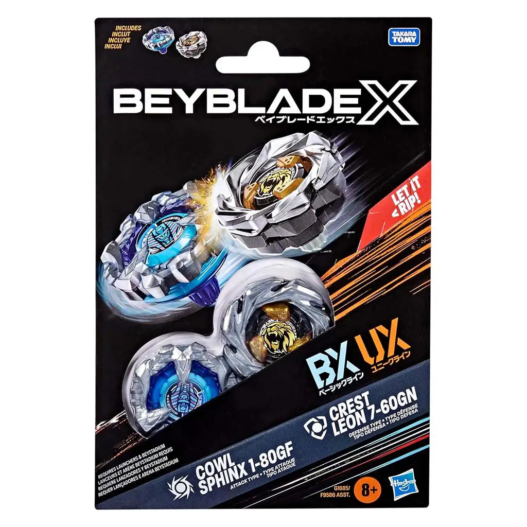 Beyblade X toy box front shows silver layered tops with blue and gold centers bursting forward on a black backdrop with bright orange streaks and clear labeling for included components.