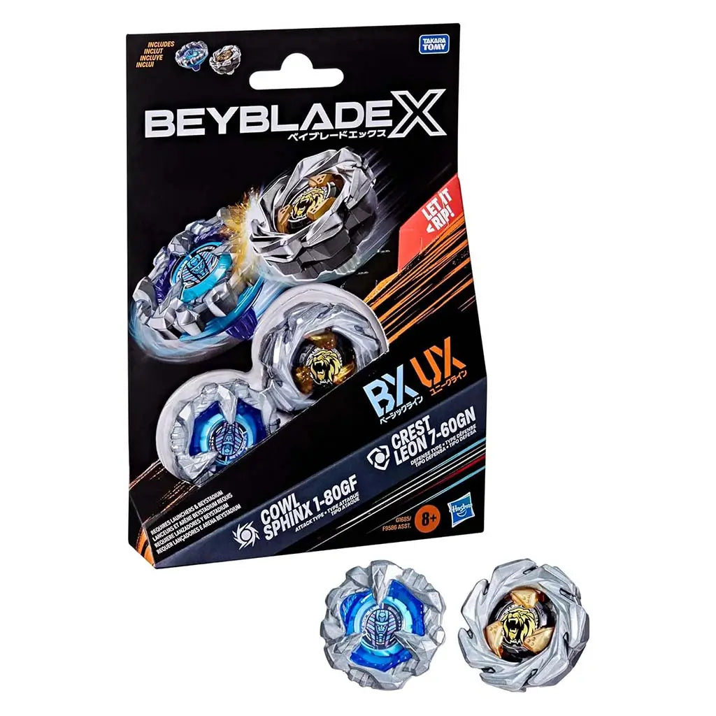 Beyblade X toy packaging shows silver and blue plastic tops with angular forms highlighting attack and defense themes against a black card backdrop with product stats and branding details.