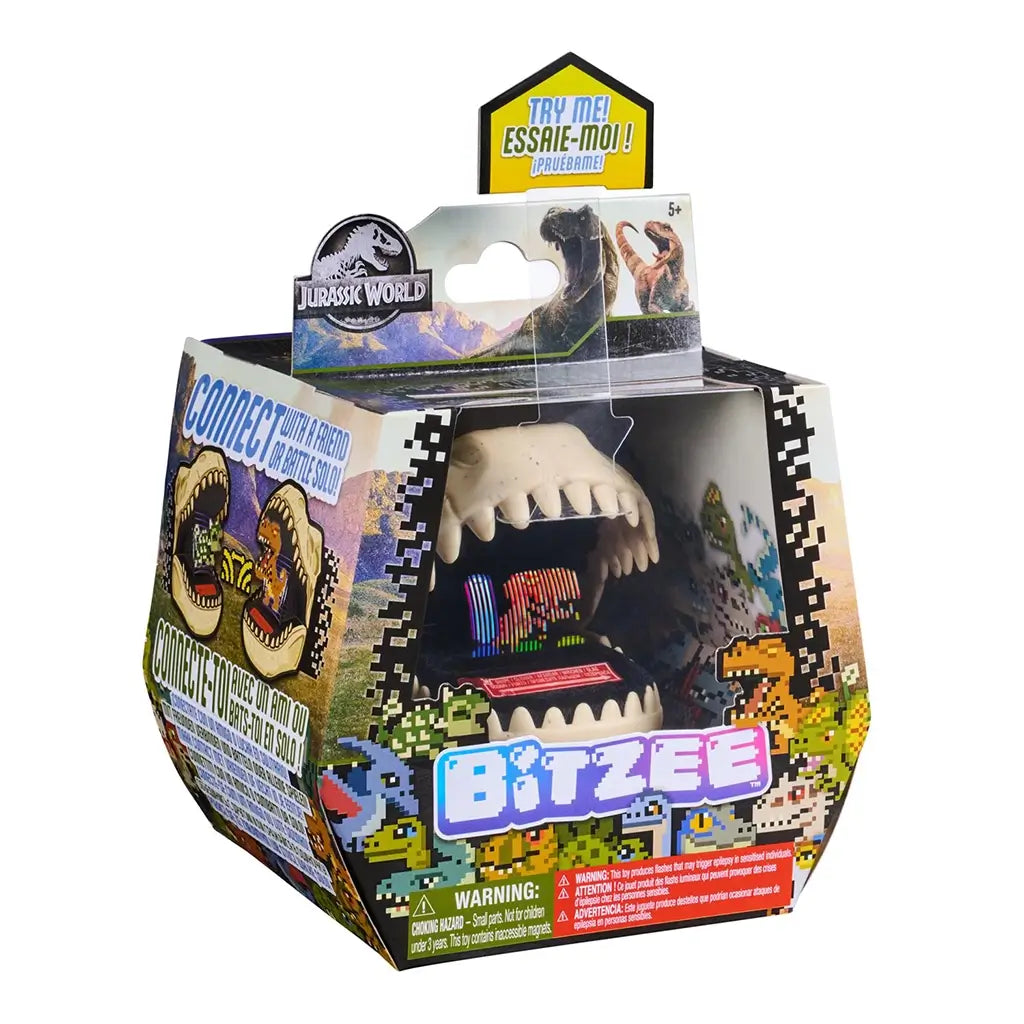 Jurassic World Bitzee digital pet toy packaging featuring multicolor pixel graphics on a cardboard box, housing a beige plastic dinosaur mouth device with LED display, shown on a white studio background.