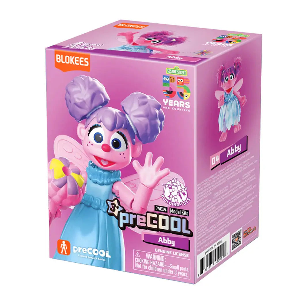 Blokees Sesame Street Abby model kit box in pink and purple design featuring Abby Cadabby in a blue dress with fairy wings, part of the preCOOL series celebrating Sesame Street’s 50th anniversary.