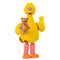 Yellow plastic Big Bird toy figure from Sesame Street holding a brown teddy bear with a red bow, featuring textured feather details, striped orange and pink legs, and a friendly waving pose.