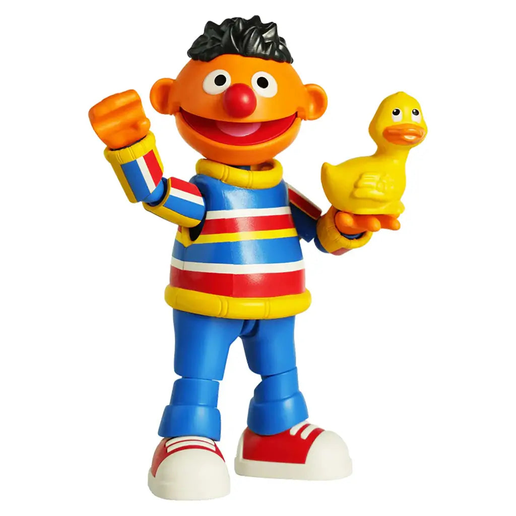 Blokees Sesame Street Ernie toy figure posed with raised arm and cheerful expression, holding his yellow rubber duckie companion.