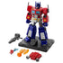 Blokees Transformers G1 Optimus Prime action figure with base and accessories including rifle, energy axe, and interchangeable parts, featuring red, blue, and silver detailing on a black display stand.