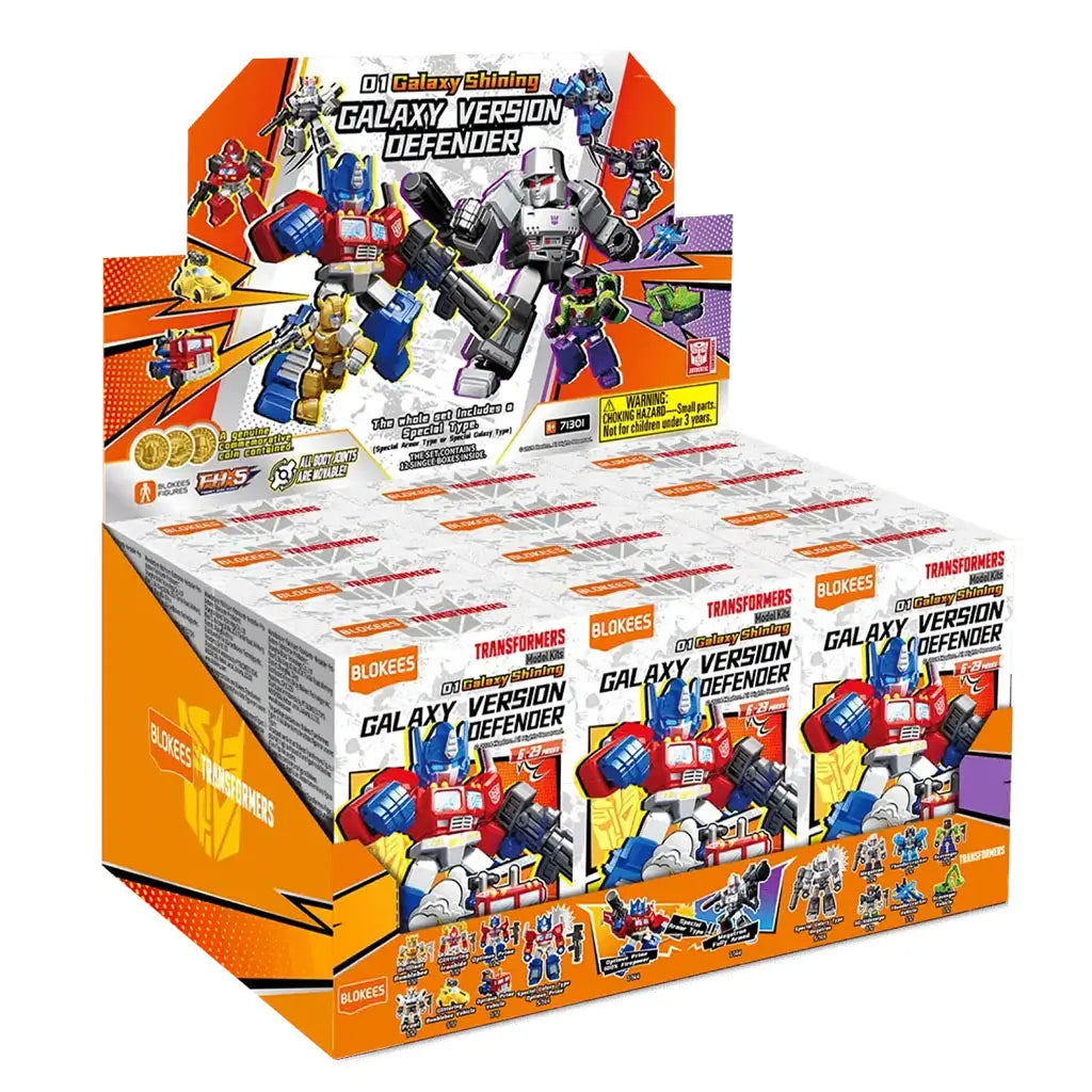 Display box containing multiple Blokees Transformers Galaxy Version Defender kits, decorated with colorful robot graphics, product branding, and promotional imagery for collectible figures.