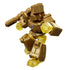 Transformers gold robot figure made of shiny metallic plastic and translucent yellow parts, blocky armor shaping, raised blaster cannon, and dramatic pose against clean studio white.