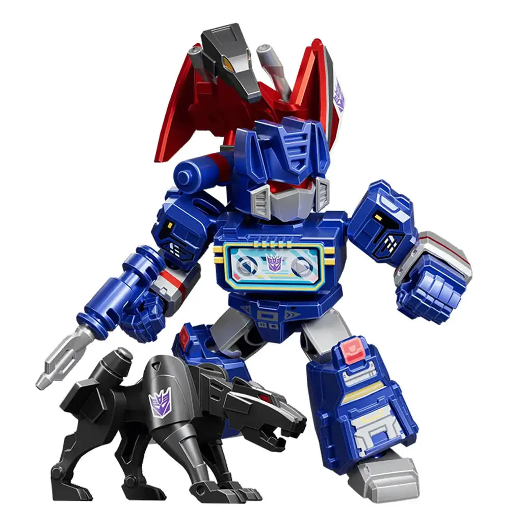 Transformers blue robot toy with angular armored panels, cassette-deck chest, companion black robotic panther, and dynamic fighting stance set against a clean white studio scene.