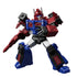 Red, blue, and gray Transformers Blokees action figure holding a blaster, posed in a dynamic stance, showing detailed chest windows and battle armor styling.