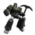 Black and gray Transformers Blokees figure wielding a pickaxe weapon, red highlights on the helmet, and sharp mechanical features from the Shattered Universe collection.