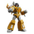 Blokees Transformers Shining 1985 toy figure of a yellow-armored robot with red eyes and shoulder weapon, striking a battle pose.