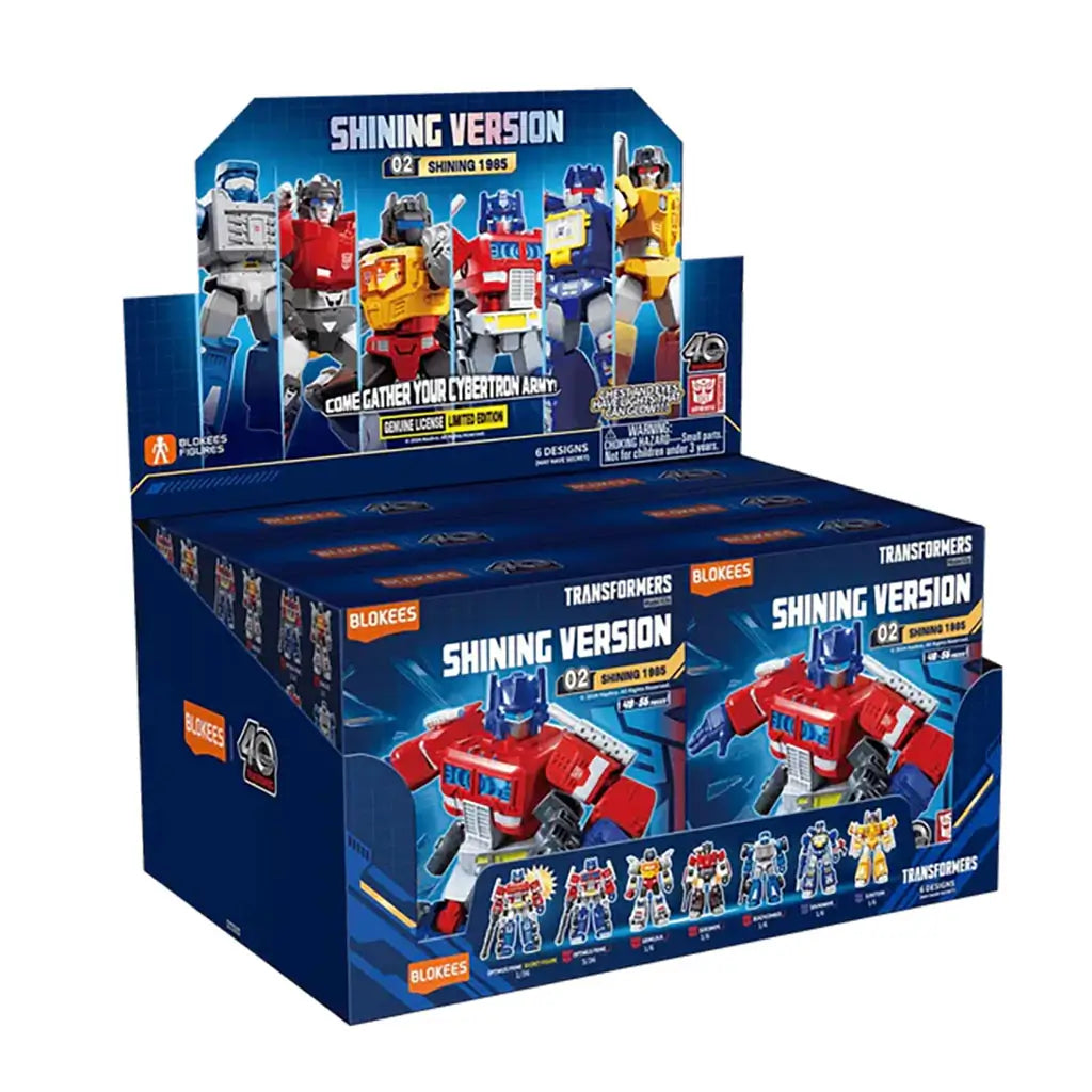 Blokees Transformers Shining Version 1985 display box showing various collectible robot figures with blue packaging design.