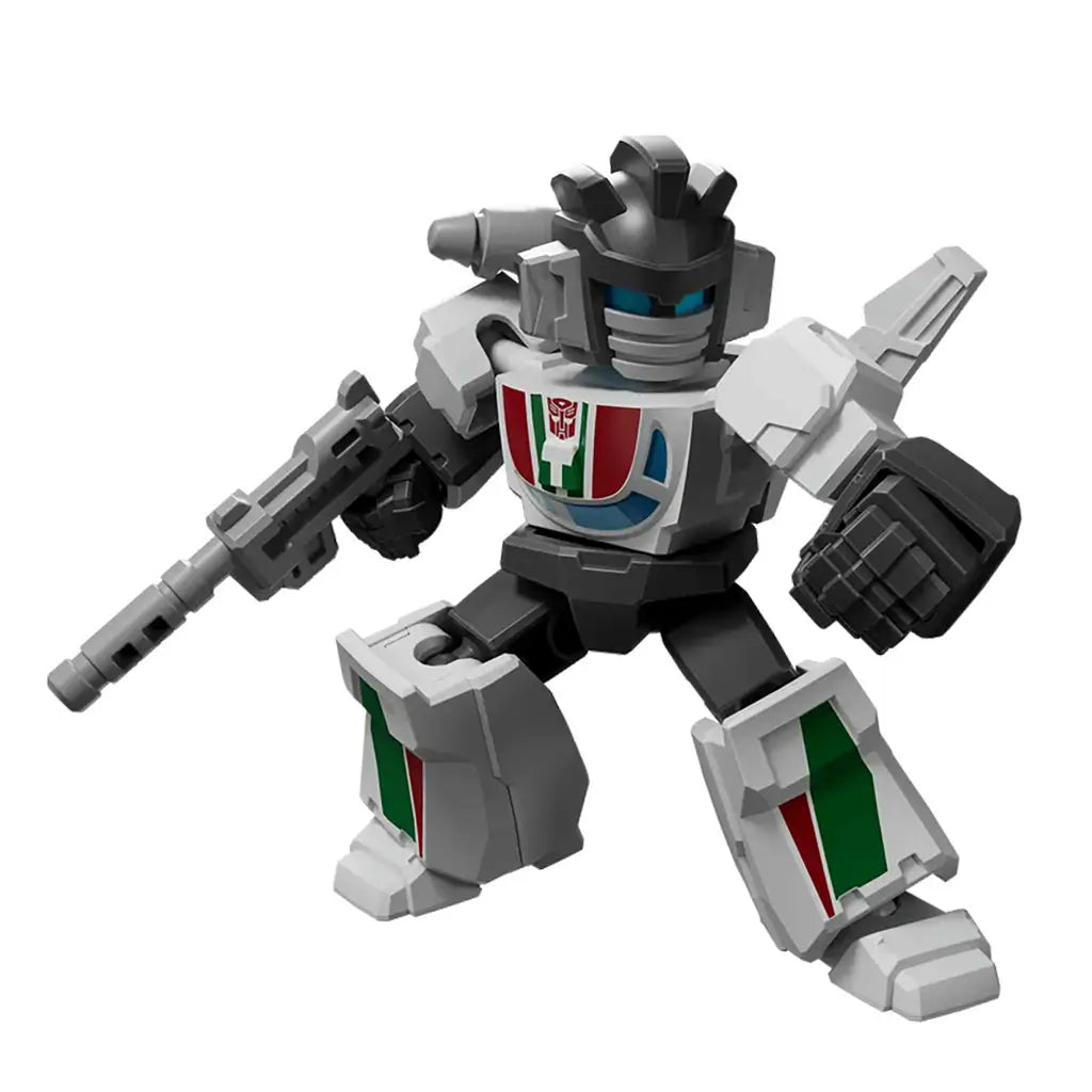 Transformers robot figure in white, gray, and black with red, green, and blue chest detailing, holding a sci-fi blaster and posed ready for action on a plain white background.