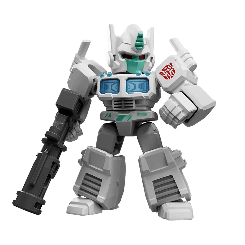 Transformers action toy featuring a gray and white robot with teal chest panels and red eyes, holding a large black blaster in a confident stance on white backdrop.