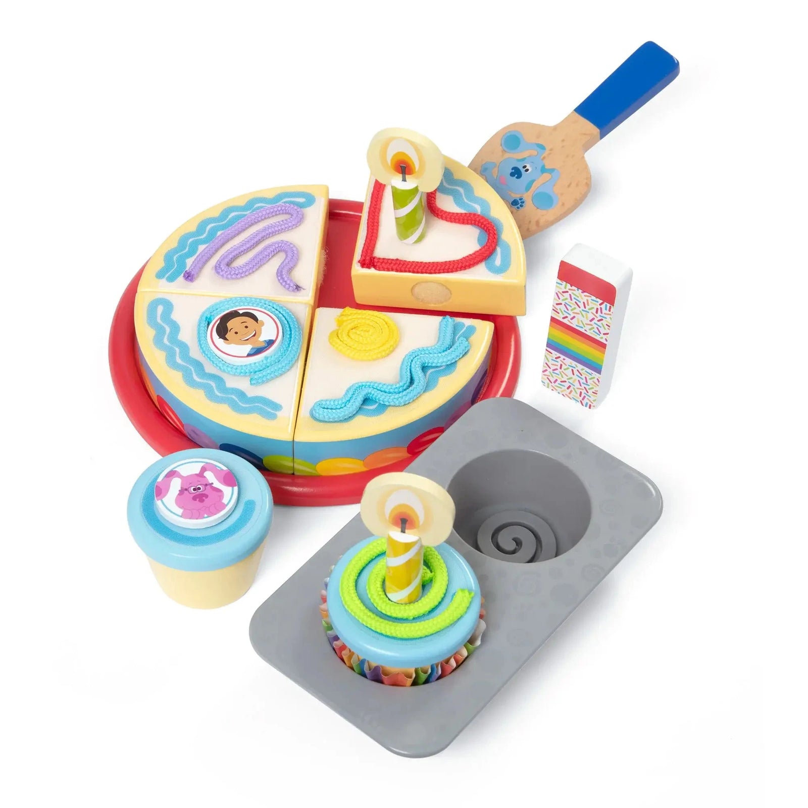 Blue’s Clues birthday-themed wooden play set featuring cake slices with icing, candles, spatula, cupcakes, and celebratory toppings for creative pretend play.