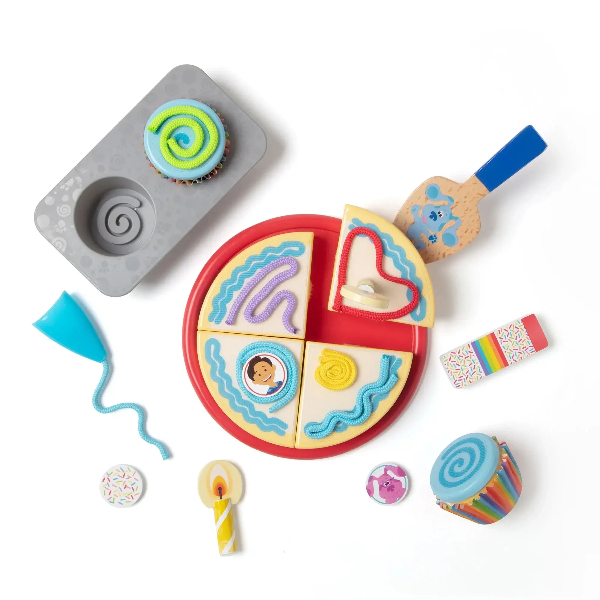 Blue’s Clues wooden birthday play set with cake slices, icing decorations, cupcakes, spatula, and candles designed for imaginative party-themed pretend play.