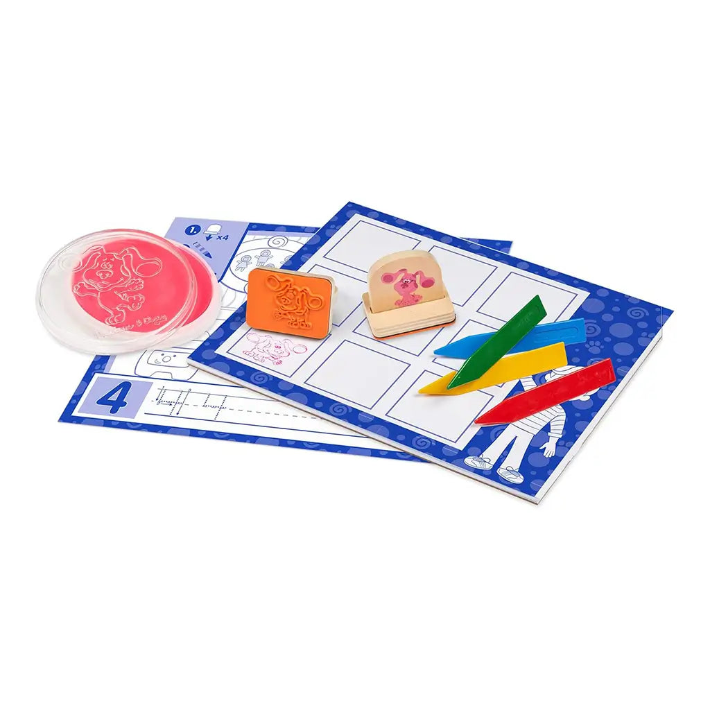 Melissa & Doug Blue’s Clues & You! stamp set with pink and blue ink pads, colorful crayons, and Blue’s Clues-themed worksheets encourages preschoolers to stamp, color, and learn through creativity.