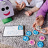 Two children play with Melissa & Doug Blue’s Clues & You! wooden mailbox set, matching illustrated wooden tokens featuring Blue and friends, fostering memory and storytelling skills through play.
