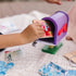 Children place a wooden postcard into the Melissa & Doug Blue’s Clues & You! mailbox, exploring pretend mail delivery, creativity, and teamwork in interactive, hands-on imaginative play.
