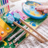 Detail of Melissa & Doug Blue’s Clues & You! wooden music maker board showing textured paw-shaped drumsticks resting on the xylophone, supporting hand–eye coordination and rhythmic play.