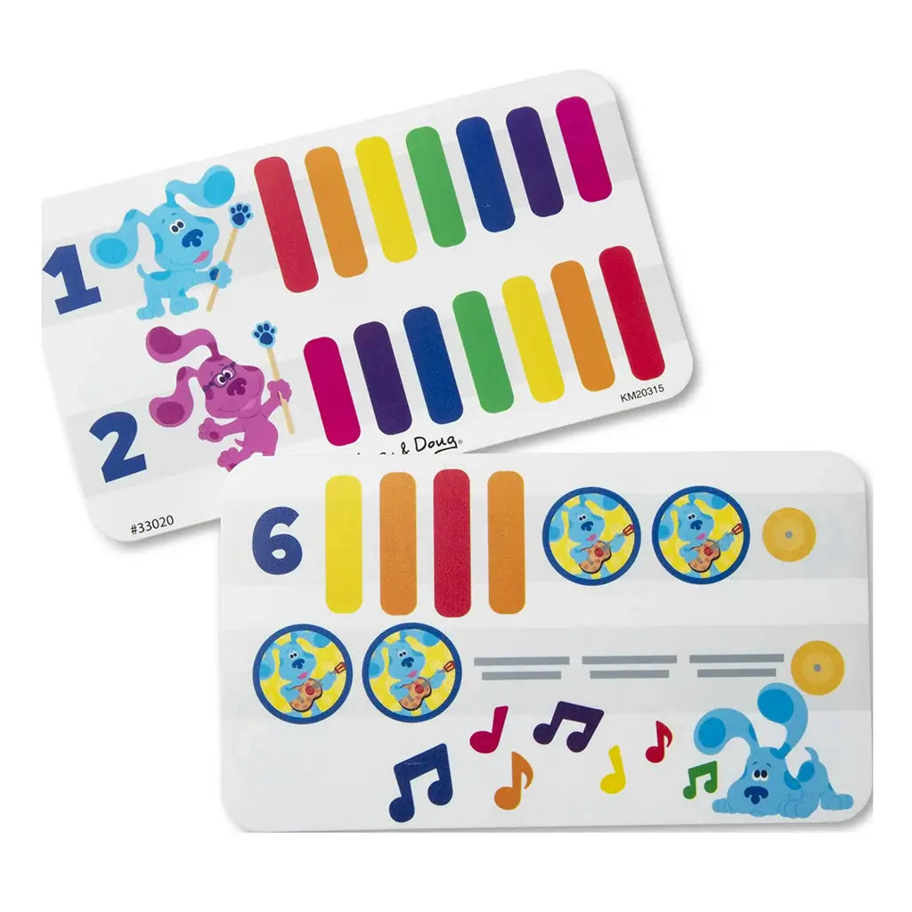 Melissa & Doug Blue’s Clues & You! wooden music cards showing colorful rainbow bars and character illustrations of Blue and Magenta, designed to guide toddlers in playing simple musical patterns.