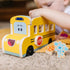 A child plays with the Melissa & Doug Blue’s Clues & You! wooden pull-back school bus, loading Blue and friends for a pretend ride that builds imagination and coordination.