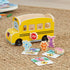 Melissa & Doug Blue’s Clues & You! wooden school bus toy with Blue, Magenta, and friends beside illustrated cards, promoting pretend play and storytelling while enhancing fine motor skills.