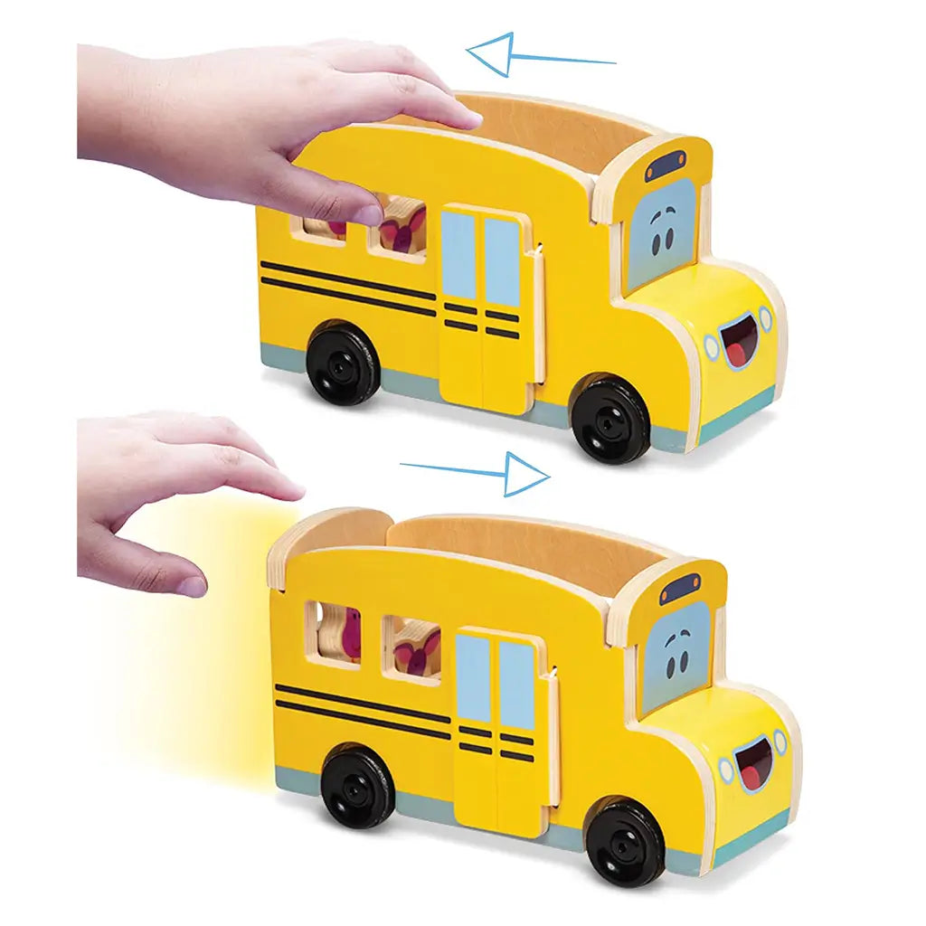 Demonstration of Melissa & Doug Blue’s Clues & You! wooden school bus showing pull-back and release motion for active play, encouraging motor skills and cause-and-effect learning.