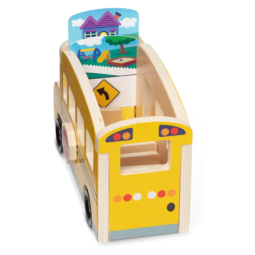 Rear angled view of Melissa & Doug Blue’s Clues & You! wooden pull-back school bus showing interior slots and illustrated destination cards, encouraging creative sorting and pretend driving play.