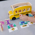 Close-up of Melissa & Doug Blue’s Clues & You! wooden pull-back school bus toy with a child flipping the red stop sign, engaging in imaginative and hands-on role play.
