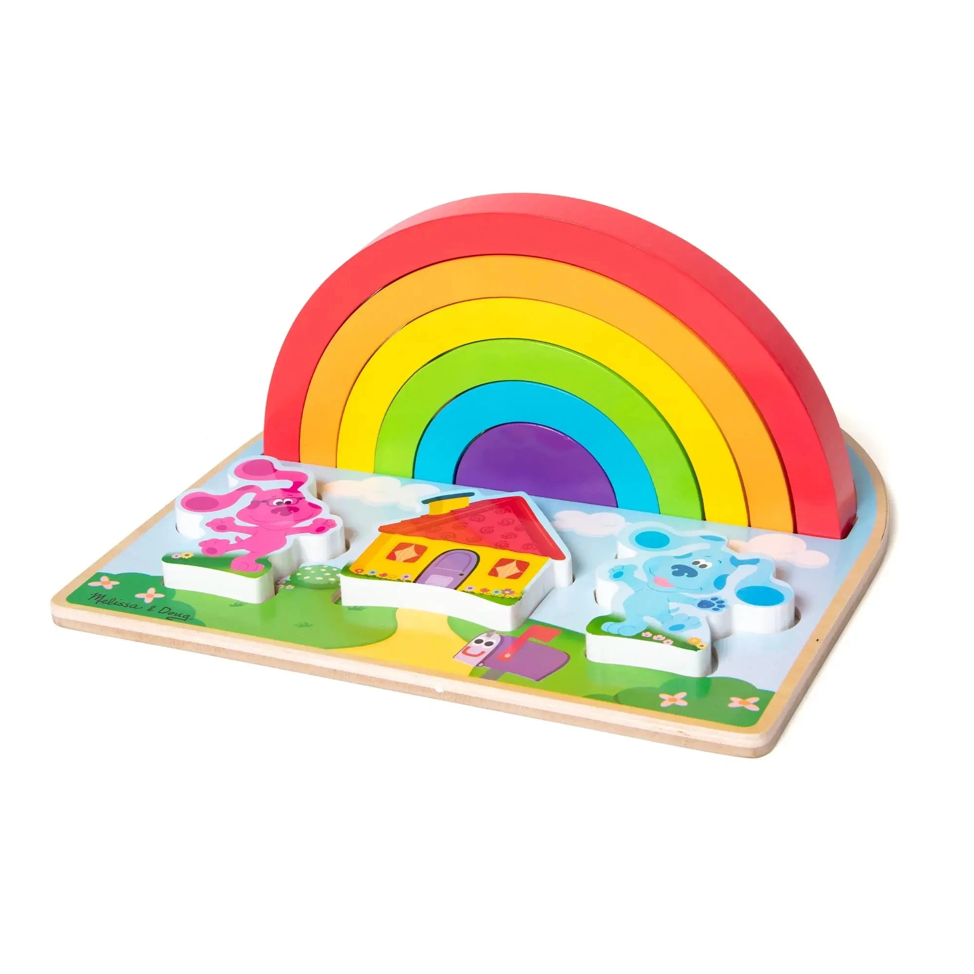 Side view of Melissa & Doug Blue’s Clues rainbow stacking puzzle showing assembled arches, Blue and Magenta pieces, and a bright red-roofed cartoon house.