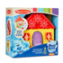 Packaging of Melissa & Doug Blue’s Clues wooden take-along house featuring shape sorter, puzzle blocks, gears, and character pieces; includes 8 total pieces.