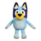Bluey plush toy in soft light-blue and navy fabric shows a rounded dog shape with a bright yellow muzzle, large embroidered eyes, and outstretched limbs displayed clearly against a plain white backdrop.