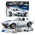 Hot Wheels Corvette Grand Sport building toy kit shown in white plastic bricks with blue racing stripes, detailed coupe body, chrome-style wheels, and side exhaust, displayed on a clean studio background.