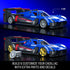 Hot Wheels Cadillac Project GTP hypercar building set in blue with black and red accents, smooth brick construction, aerodynamic race-car shape, swappable wheels and decals, presented on a dark blue promotional backdrop.