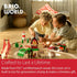 Two children playing on the floor with a BRIO wooden railway set, showcasing FSC-certified beech wood tracks, colorful accessories, and imaginative play in a cozy living room.