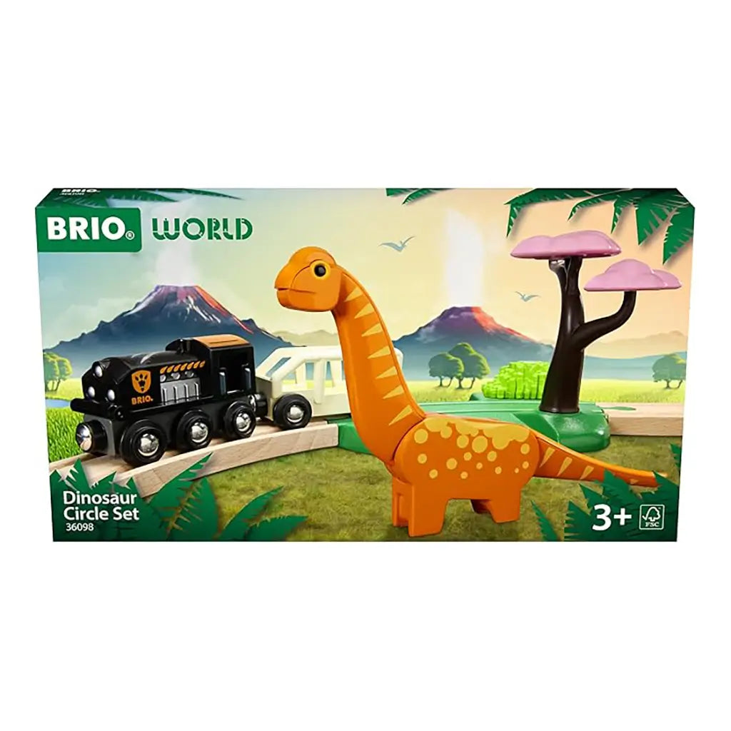 Front of BRIO Dinosaur Circle Train Set box featuring colorful artwork of black locomotive, orange dinosaur, and pink tree in prehistoric volcanic landscape.