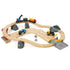 Wooden BRIO rail and road loading set with curved beech wood tracks, colorful toy trucks, cargo train, crane, and rocky scenery designed for imaginative quarry-themed play.