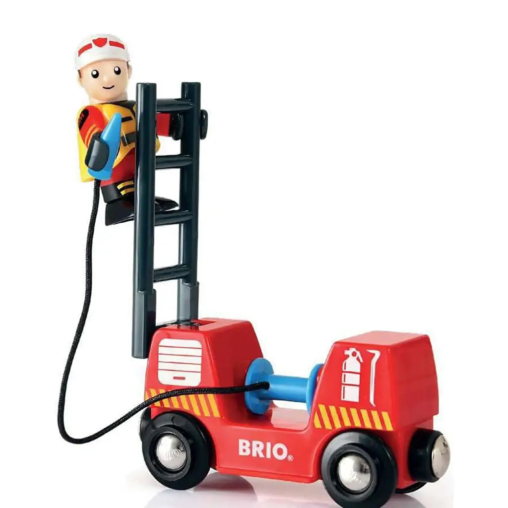 BRIO Firefighter toy shows a smiling firefighter figure climbing a black ladder with hose on a red fire truck wagon featuring wheels and yellow-striped fire safety graphics.