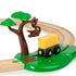 BRIO Safari Railway Set toy shows a plastic brown monkey hanging from a green tree while a yellow block sits on a black wagon, positioned along curved wooden railway tracks.