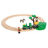 BRIO Safari Railway Set fully assembled with wooden tracks forms a circle, featuring a ranger, zebra, green train, and tree with a monkey and yellow block play feature.