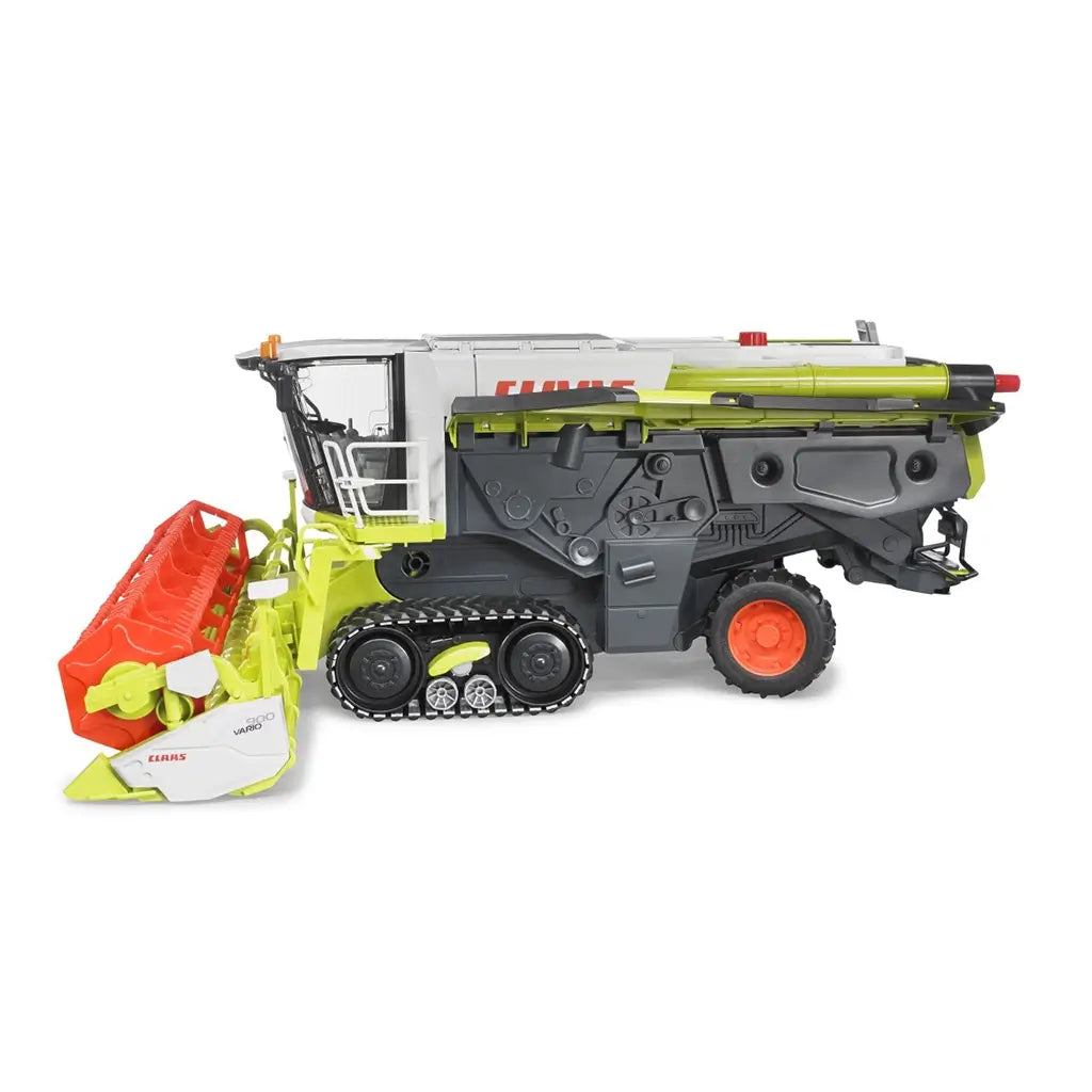 Side view of the Bruder Claas Lexion 780 Combine Harvester 1:16 scale toy model, featuring tracked wheels and a detachable red cutting header.