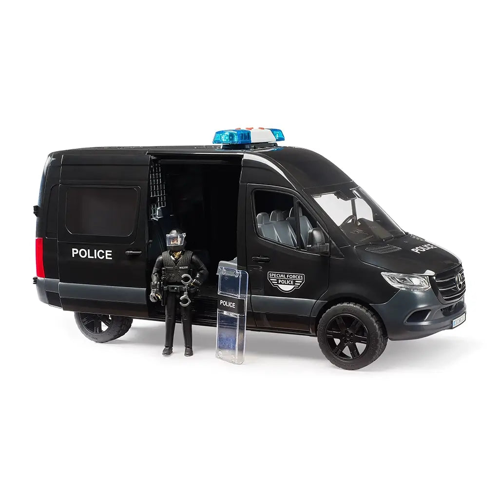 Bruder Mercedes-Benz Sprinter police van toy in black plastic with gray and blue details, featuring an open sliding door, police figure, clear riot shield, and handcuffs on white.