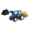 Detailed New Holland T5.120 1:16 scale blue toy tractor with black bucket loader and orange rear box holding a rolled hay bale, shown on a white background to highlight farming equipment realism.