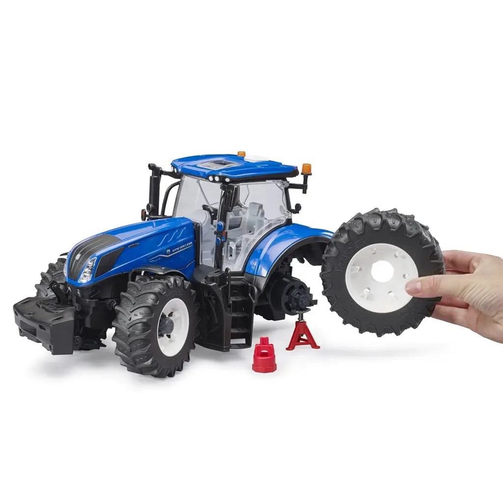 Bruder New Holland T7.340 tractor set featuring two mechanic figures performing maintenance, with removable tires and accessories.