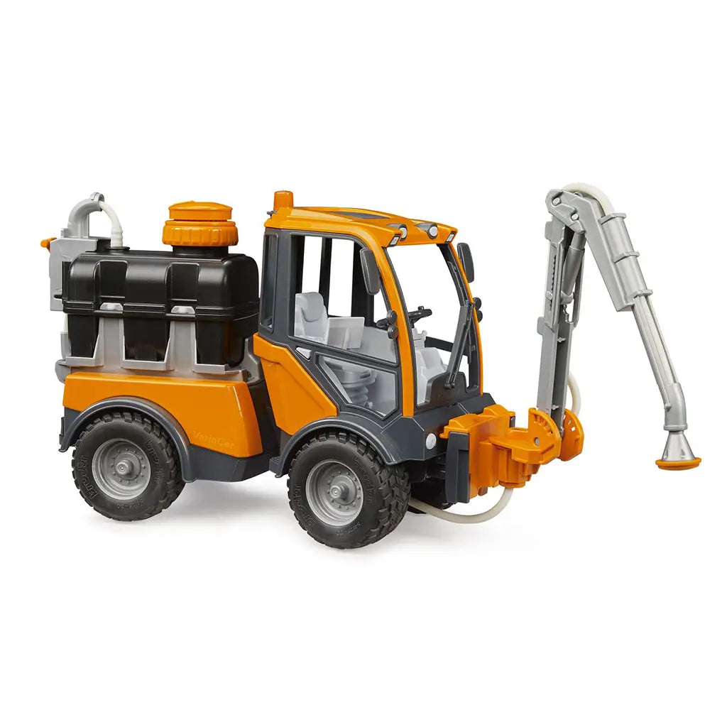 BRUDER VarioCar irrigation vehicle features orange, black, and gray plastic construction, rugged wheels, rear water tank, detailed cab, hoses, and extended sprinkler arm.