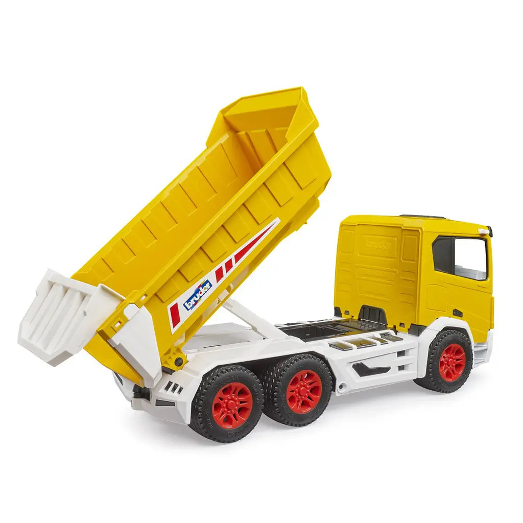 Toy dump truck Bruder Roadmax features bright yellow plastic body with sturdy textured components and a raised tipping bed, shown from a rear angled view on a white background for construction play.