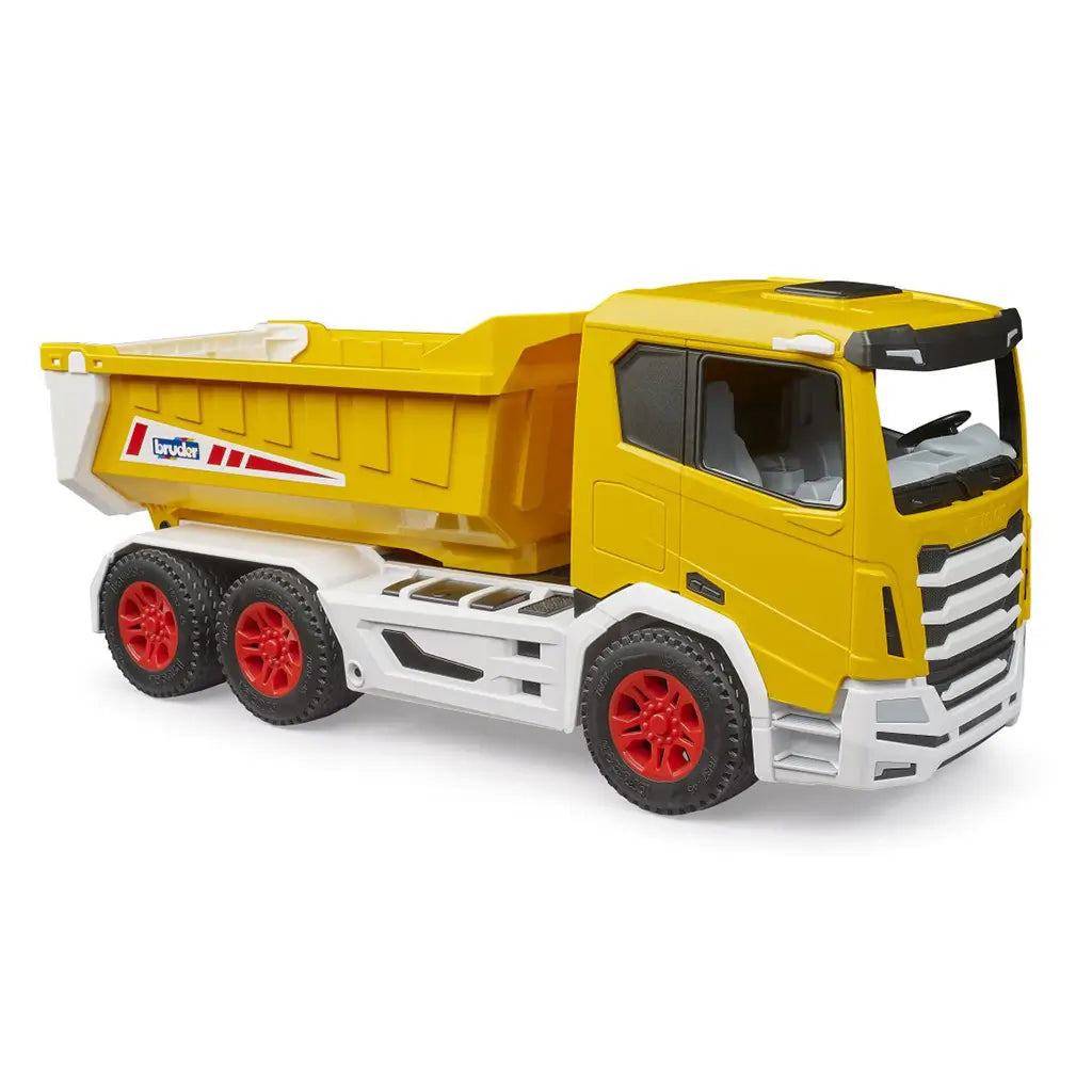 Toy dump truck Bruder Roadmax displays a yellow molded plastic cab and deep cargo bed with rugged red wheels and tread, captured in a clean side view on a white backdrop that highlights construction-theme play.