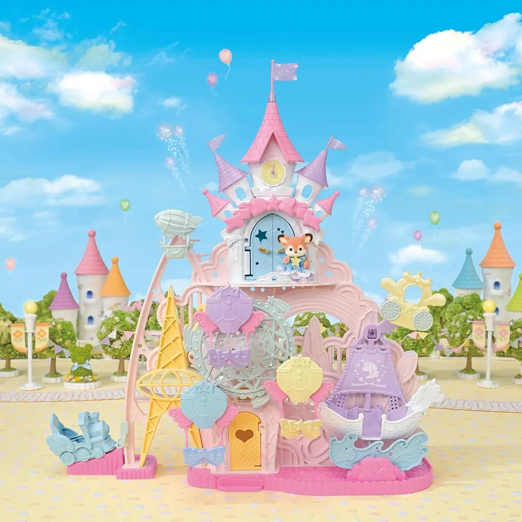 Calico Critters Baby Dream Amusement Park castle shows pastel pink plastic towers, Ferris wheel, swan boat ride, and hot air balloon gondola arranged in bright outdoor fairground setting.