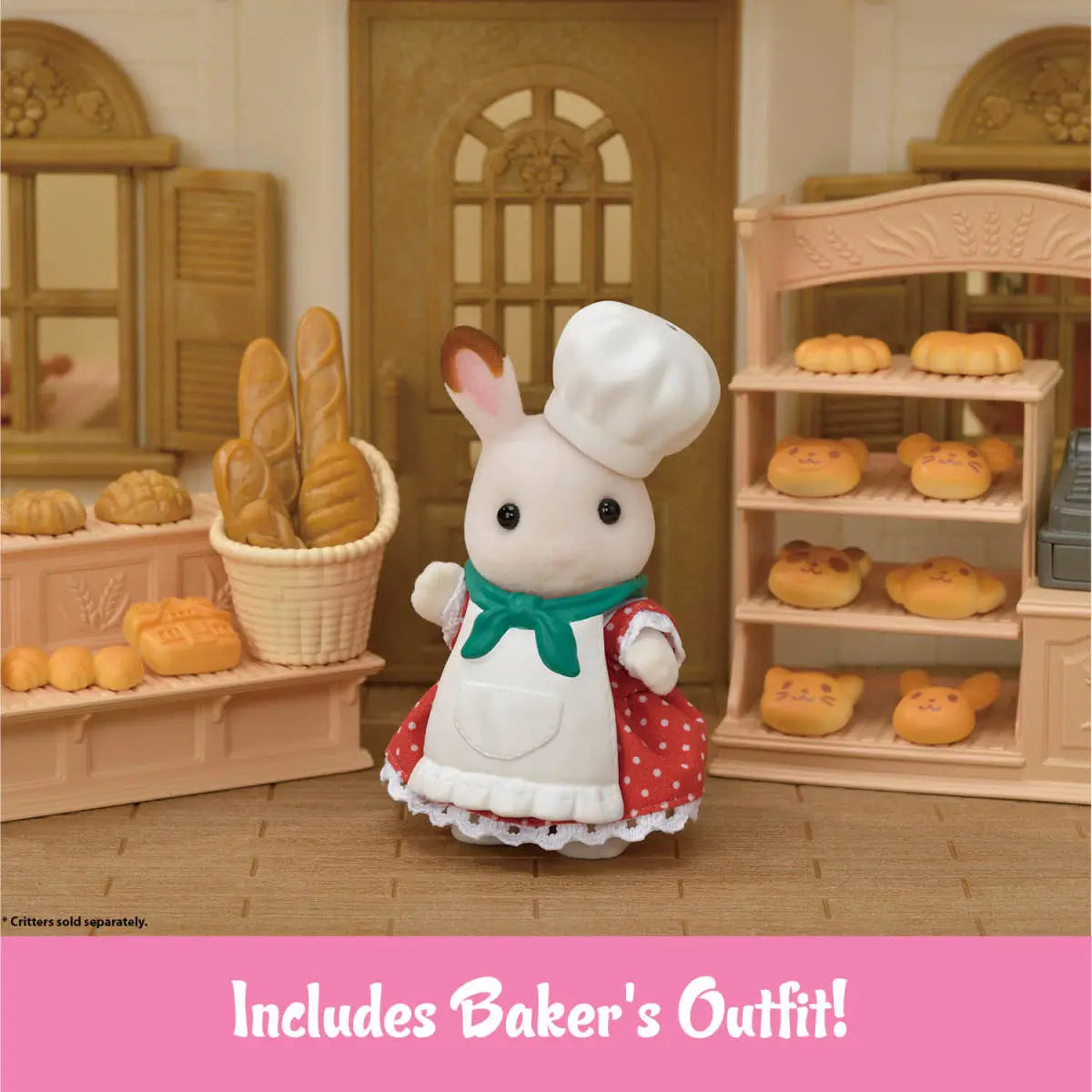 Calico Critters baker outfit with white chef hat, white apron, green neck scarf, and red polka dot dress worn by rabbit figure standing before bread shelves in bakery interior.