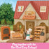 Calico Critters bakery shop cottage with cream walls and red roof, textured plastic façade, arched windows, brick oven, display shelves, and bunny baker figure in outdoor garden backdrop.